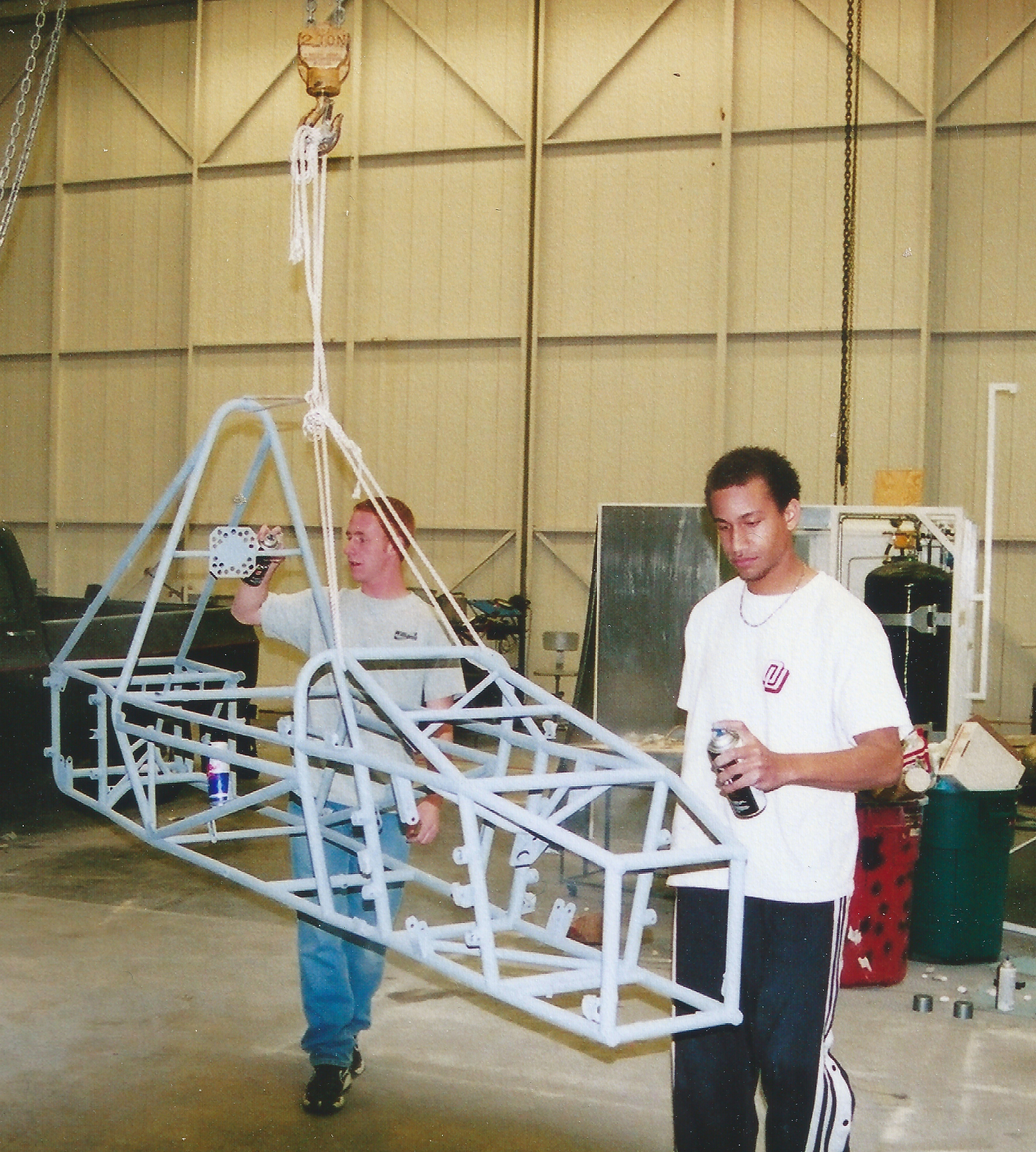 Devin (pictured right) and teammate working on the Sooner Racing Team car in 2001.